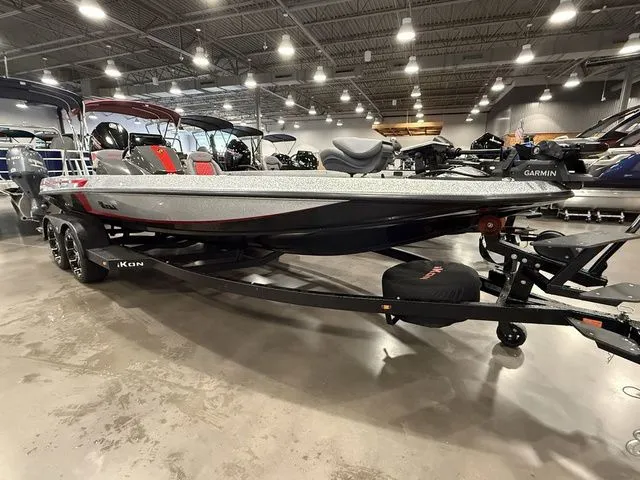 Slide: The Image of 2026 Ikon Boats LXE20 displayed in a showroom, featuring sleek design and modern equipment. - 2