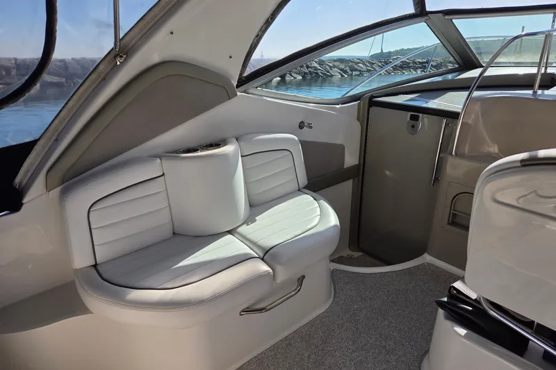 Slide: The Image of 2007 Sea Ray 290 Sundancer interior with white seating and sleek design. - 3