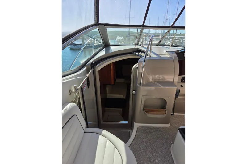 Slide: The Image of Interior view of 2007 Sea Ray 290 Sundancer boat with open cabin door. - 4