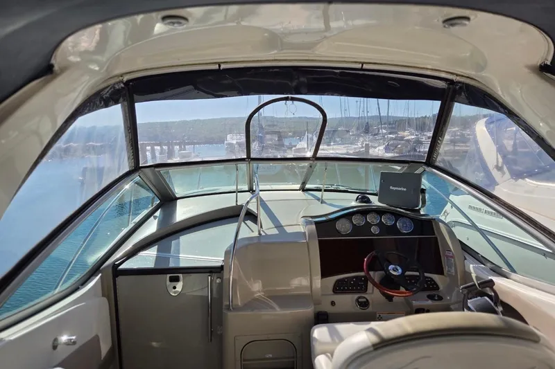 Slide: The Image of Interior view of 2007 Sea Ray 290 Sundancer boat cockpit with navigation equipment. - 6