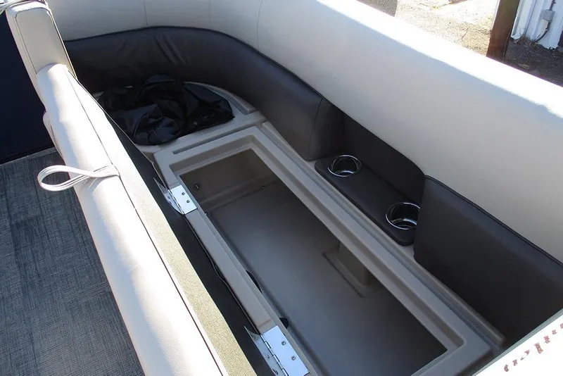 Slide: The Image of 2026 Bentley Pontoons Legacy 243 Swingback interior seating with storage and cup holders. - 15