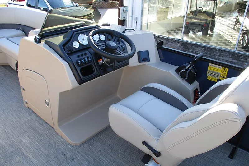 Slide: The Image of 2026 Bentley Pontoons Legacy 243 Swingback helm with modern controls and comfortable seating. - 22