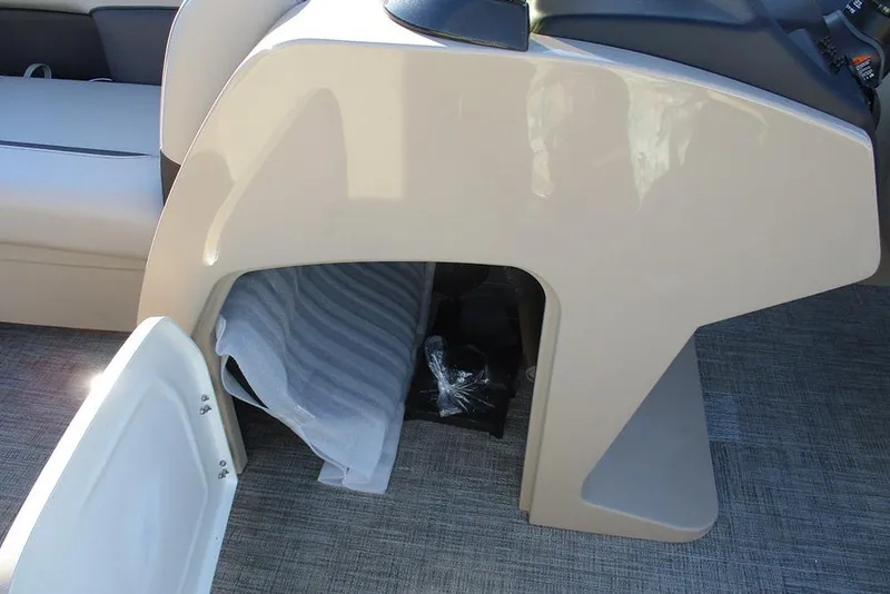 Slide: The Image of 2026 Bentley Pontoons Legacy 243 Swingback interior storage compartment with open door. - 23