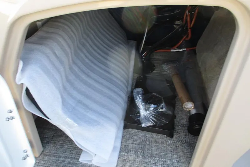 Slide: The Image of Storage compartment of 2026 Bentley Pontoons Legacy 243 Swingback with various items inside. - 24