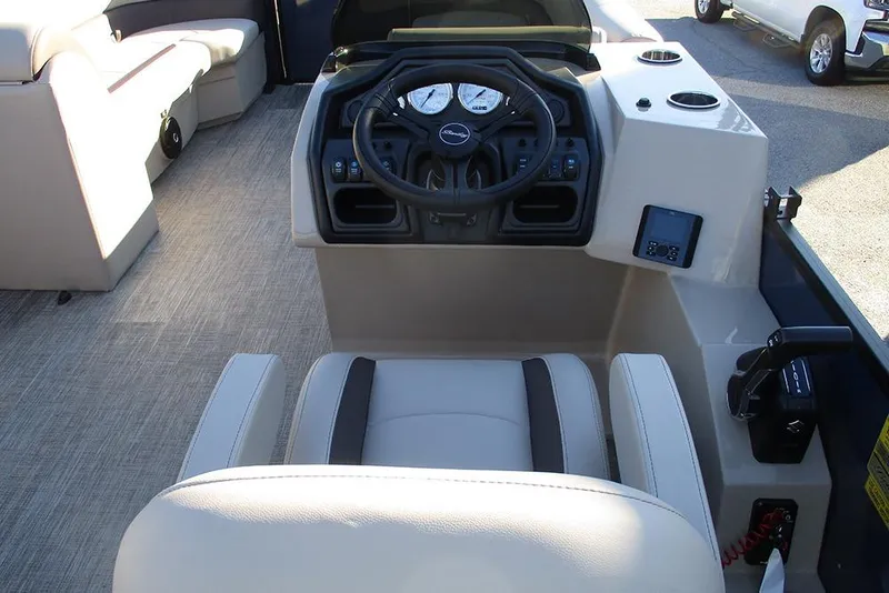 Slide: The Image of 2026 Bentley Pontoons Legacy 243 Swingback helm with steering wheel and controls. - 25