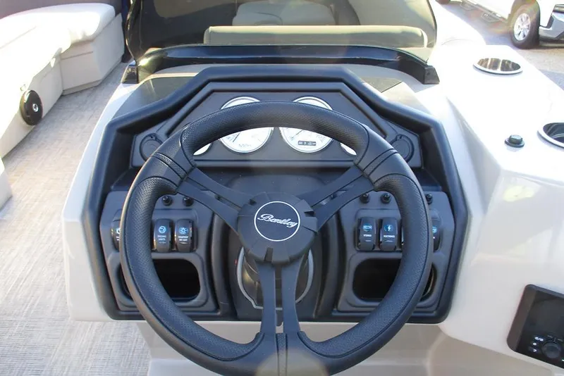 Slide: The Image of Steering console of 2026 Bentley Pontoons Legacy 243 Swingback with gauges and controls. - 26