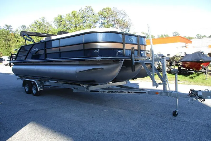Slide: The Image of 2026 Bentley Pontoons Legacy 243 Swingback on trailer, parked outdoors. - 4