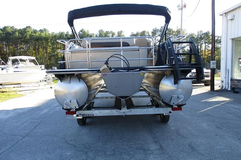 Slide: The Image of 2026 Bentley Pontoons Legacy 243 Swingback on trailer, rear view, outdoors. - 7
