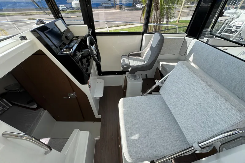 Slide: The Image of 2026 Jeanneau NC Sport 795 Series 2 interior with modern seating and steering console. - 13