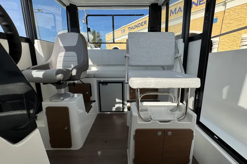Slide: The Image of Interior of 2026 Jeanneau NC Sport 795 Series 2 boat, featuring modern seating and controls. - 16