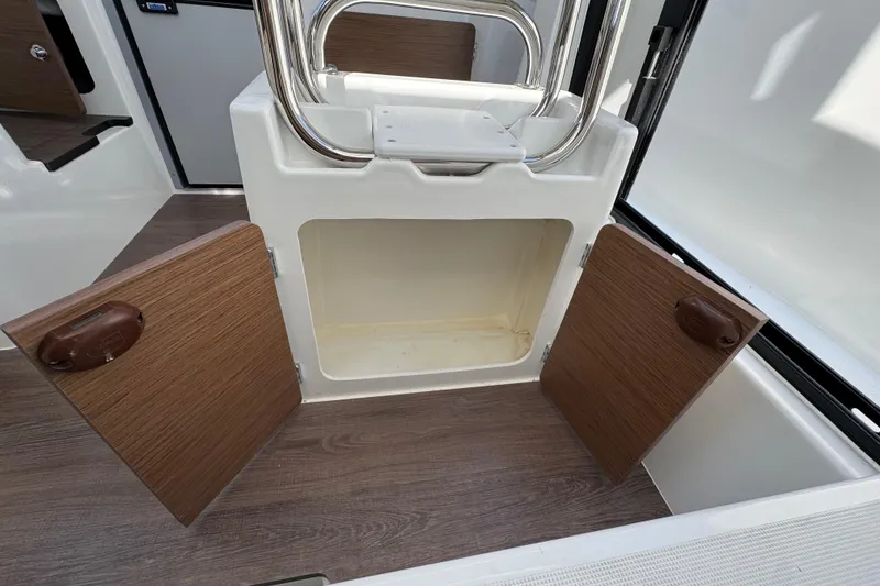 Slide: The Image of Open storage compartment on Jeanneau NC Sport 795 Series 2 boat, 2026 model. - 17