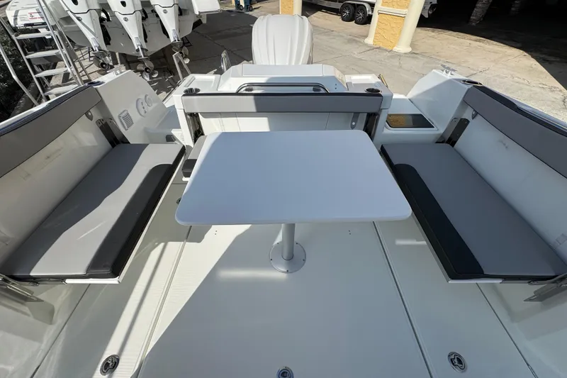 Slide: The Image of 2026 Jeanneau NC Sport 795 Series 2 boat interior with seating and table. - 5