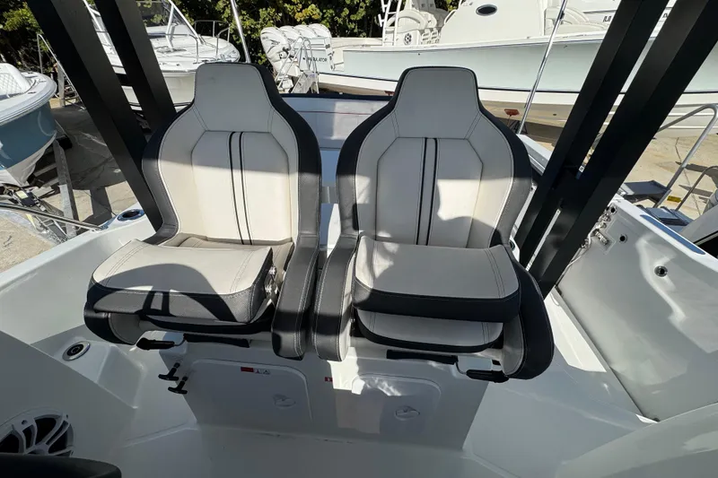 Slide: The Image of 2026 Jeanneau Leader 9.0 WA Series 2 boat seats, modern design, black and white upholstery. - 16