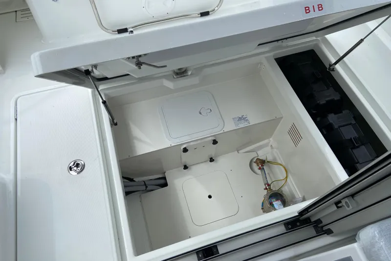 Slide: The Image of Storage compartment in the Jeanneau NC 795 Series 2 boat. - 11