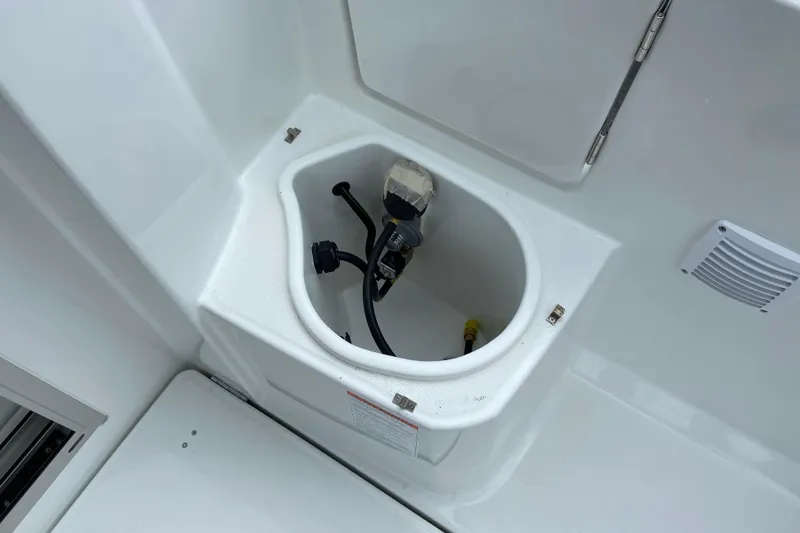 Slide: The Image of 2026 Jeanneau NC 795 Series 2 boat compartment with cables and connectors. - 13