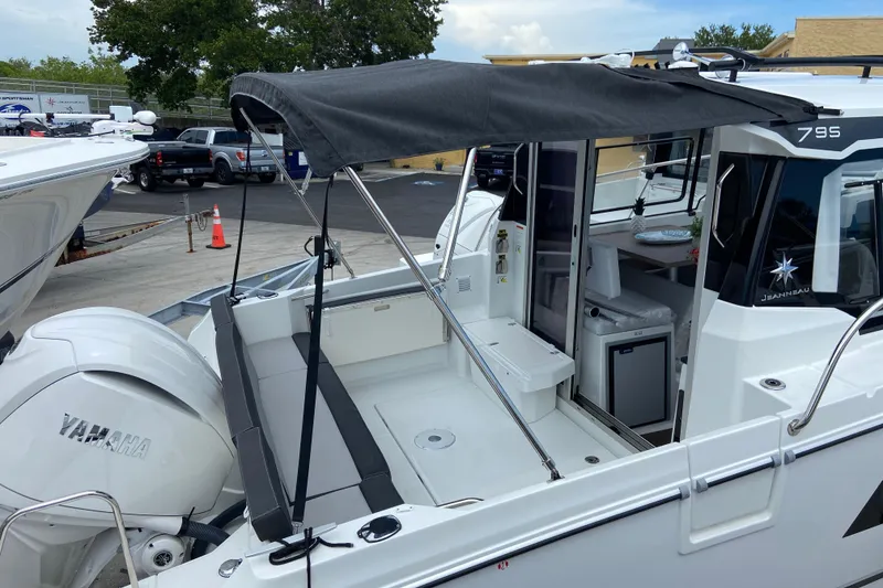 Slide: The Image of 2026 Jeanneau NC 795 Series 2 boat with Yamaha engine, docked outdoors. - 15