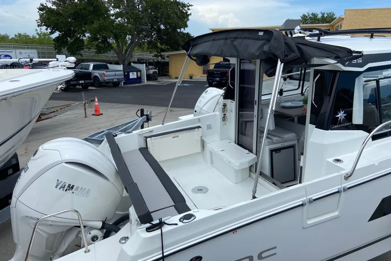 Slide: The Image of 2026 Jeanneau NC 795 Series 2 boat with Yamaha engine, docked at marina. - 16