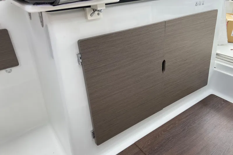 Slide: The Image of 2026 Jeanneau NC 795 Series 2 interior with sleek wooden cabinetry. - 21