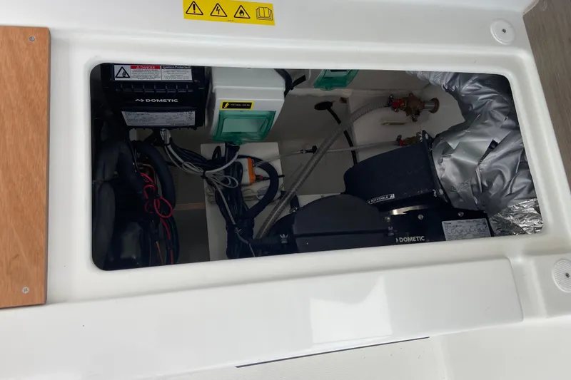 Slide: The Image of Engine compartment of 2026 Jeanneau NC 795 Series 2 boat, featuring Dometic equipment. - 36