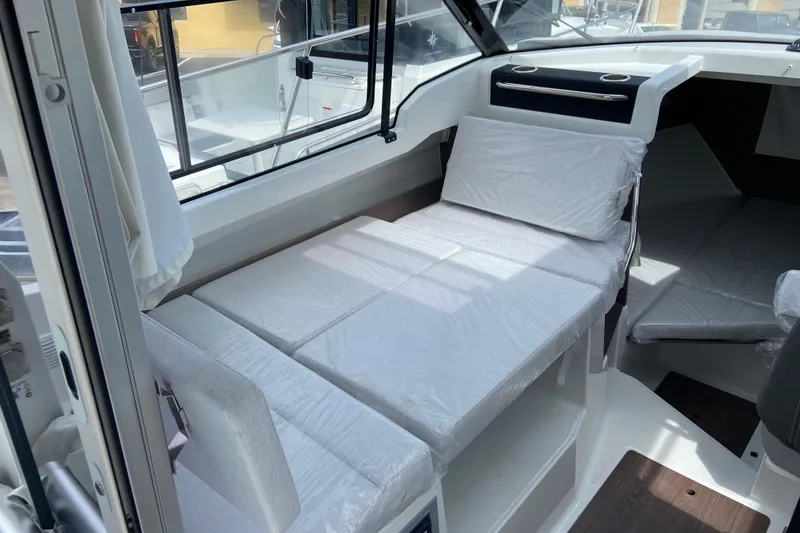 Slide: The Image of 2026 Jeanneau NC 795 Series 2 interior with convertible seating and modern design. - 37