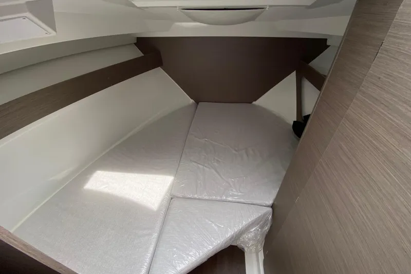 Slide: The Image of 2026 Jeanneau NC 795 Series 2 cabin interior with modern design and comfortable bedding. - 38