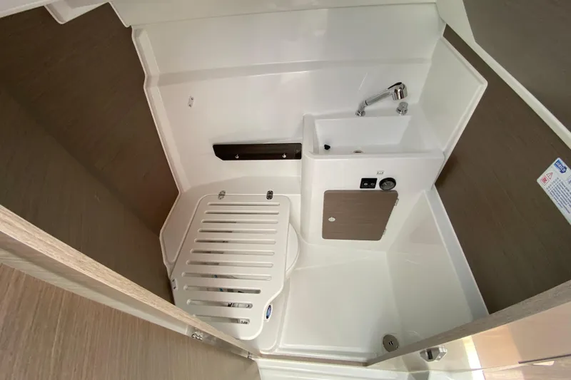 Slide: The Image of Interior view of the 2026 Jeanneau NC 795 Series 2, featuring a sink and shower area. - 41