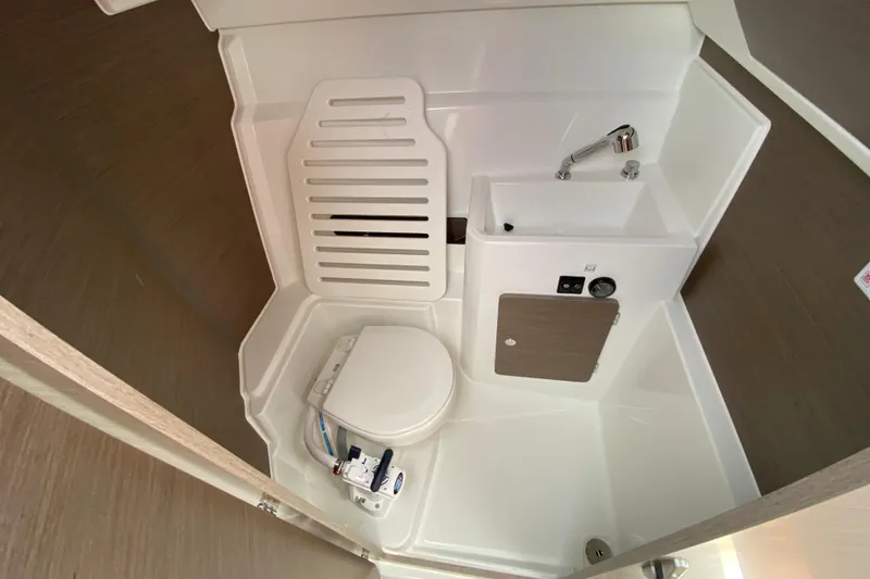 Slide: The Image of Compact bathroom in 2026 Jeanneau NC 795 Series 2 boat, featuring toilet and sink. - 42