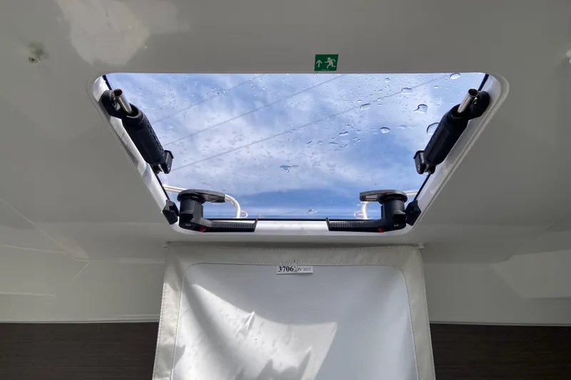 Slide: The Image of Skylight view from Jeanneau NC 795 Series 2 boat, 2026 model, showing blue sky. - 44