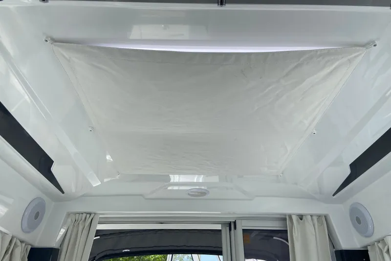 Slide: The Image of Interior view of 2026 Jeanneau NC 795 Series 2 boat ceiling with fabric panel. - 46