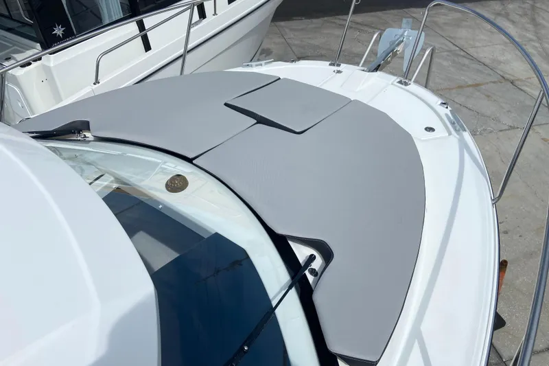 Slide: The Image of 2026 Jeanneau NC 795 Series 2 boat deck with cushioned seating and sleek design. - 49