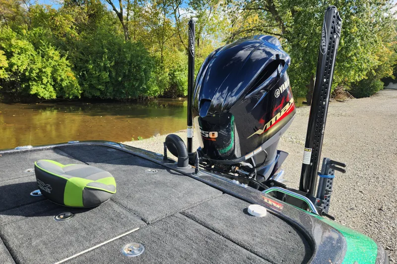 Slide: The Image of 2019 Skeeter FX21 boat with Yamaha VMAX engine by a riverbank. - 17
