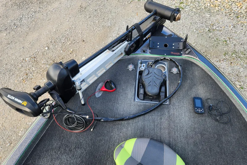 Slide: The Image of 2019 Skeeter FX21 boat deck with Minn Kota trolling motor and electronic equipment. - 21