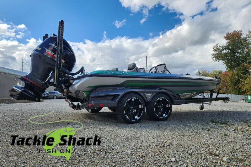 Slide: The Image of 2019 Skeeter FX21 boat on trailer at Tackle Shack, featuring Yamaha outboard motor. - 6