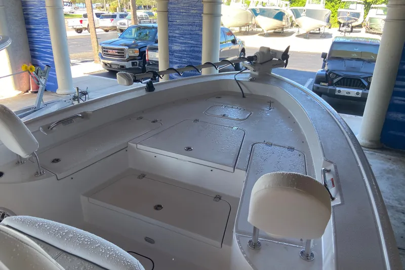 Slide: The Image of 2026 Sportsman Masters 267 Bay Boat interior with seating and storage compartments. - 13