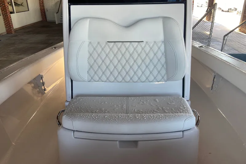 Slide: The Image of White leather seat with diamond stitching on a 2026 Sportsman Masters 267 Bay Boat. - 21