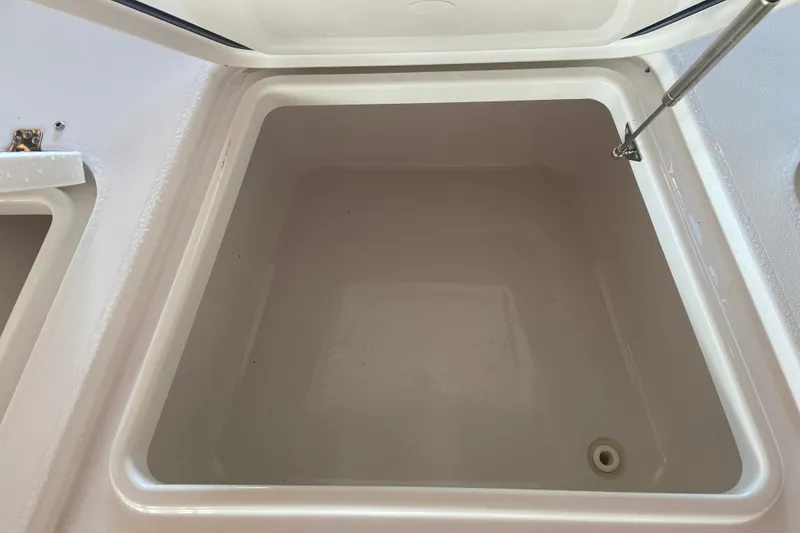 Slide: The Image of Open storage compartment on 2026 Sportsman Masters 267 Bay Boat. - 19