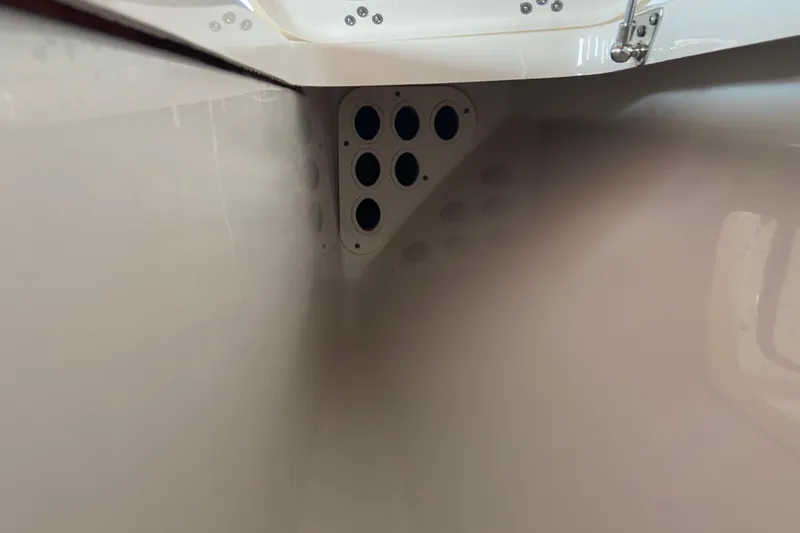 Slide: The Image of Interior view of a 2026 Sportsman Masters 267 Bay Boat, showcasing hull details. - 18
