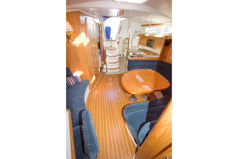Slide: The Image of Interior of 2008 Catalina 42 MkII sailboat with wood flooring and cozy seating area. - 12