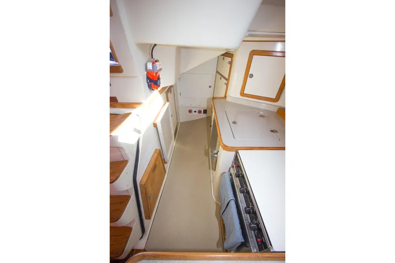 Slide: The Image of Interior of 2008 Catalina 42 MkII sailboat galley with stove and storage cabinets. - 18