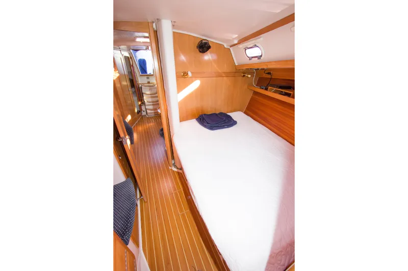Slide: The Image of Interior cabin of 2008 Catalina 42 MkII sailboat with wooden finish and cozy bed. - 21