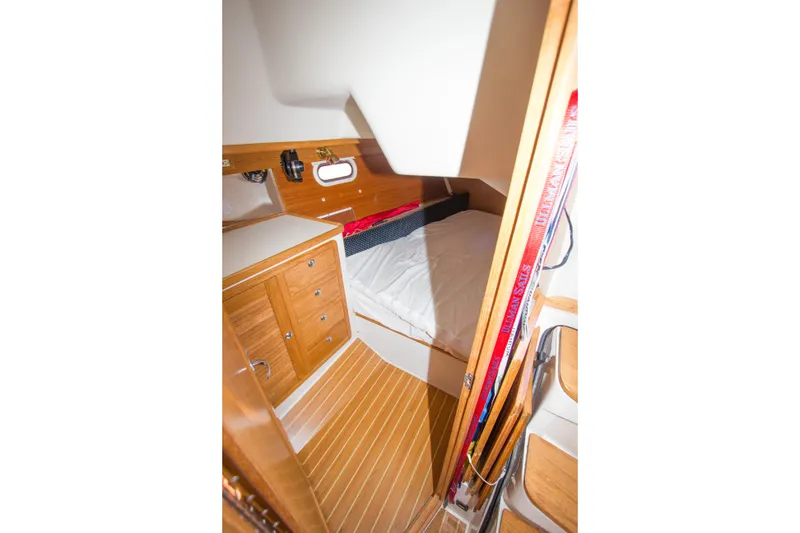 Slide: The Image of Interior cabin of 2008 Catalina 42 MkII sailboat with wooden cabinetry and bed. - 23