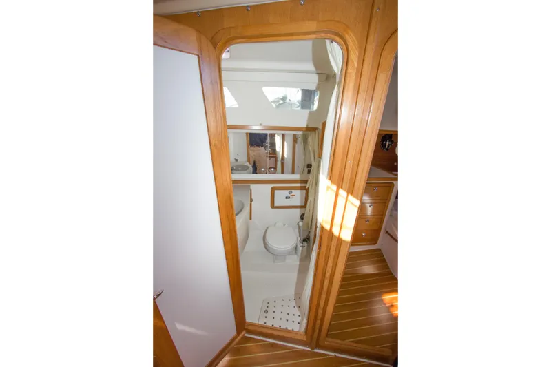 Slide: The Image of Interior view of 2008 Catalina 42 MkII yacht bathroom with wooden accents. - 25