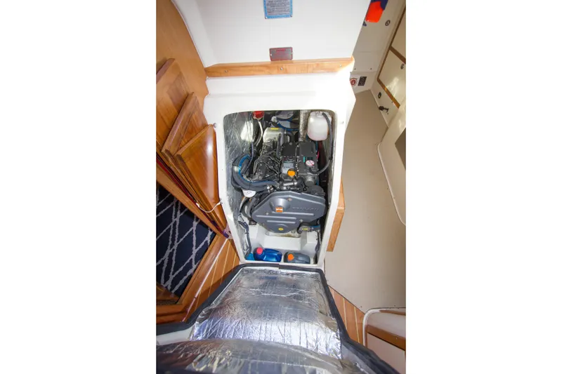 Slide: The Image of Engine compartment of a 2008 Catalina 42 MkII sailboat, showcasing detailed interior components. - 27