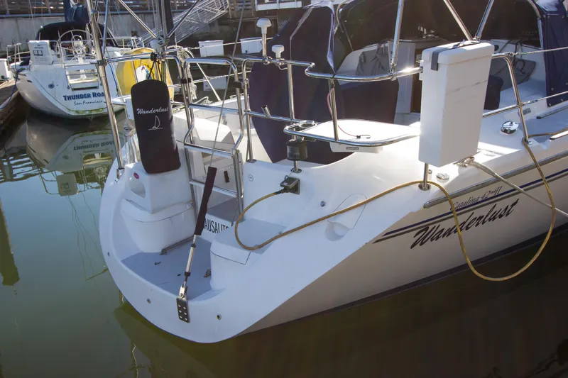 Slide: The Image of 2008 Catalina 42 MkII sailboat "Wanderlust" docked in marina, rear view. - 29