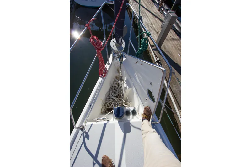 Slide: The Image of Bow of 2008 Catalina 42 MkII sailboat with ropes and dock view. - 36