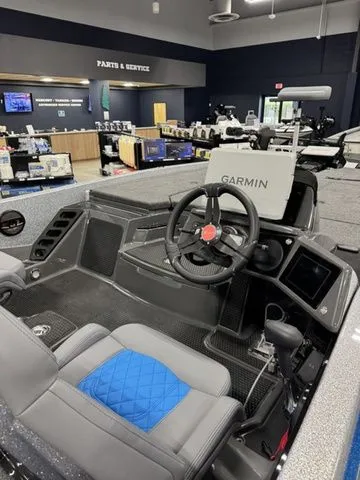 Slide: The Image of 2026 Ikon Boats LXL20 interior with Garmin navigation system in showroom. - 4