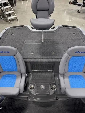 Slide: The Image of 2026 Ikon Boats LXL20 interior with gray and blue seating, showcasing modern design and functionality. - 7