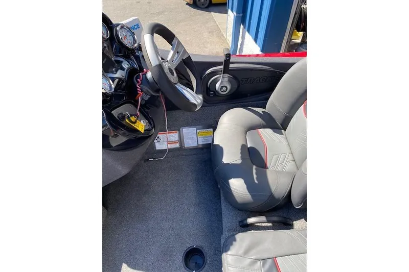 Slide: The Image of Interior of 2021 Bass Tracker Pro Team 195 TXW Team Edition boat cockpit. - 11