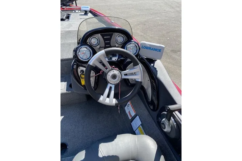 Slide: The Image of Bass Tracker Pro Team 195 TXW 2021 dashboard with steering wheel and Lowrance display. - 12