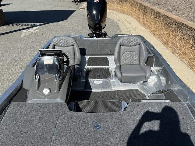 Slide: The Image of 2026 Ikon Boats VLX20 interior with dual gray seats and modern dashboard. - 13